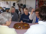 From left Sonny and Della (Laura's sister), grandma Lavetta, grandma Sara, Laura. All playing the popular family game of marbles.